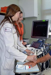 doctor examining patient