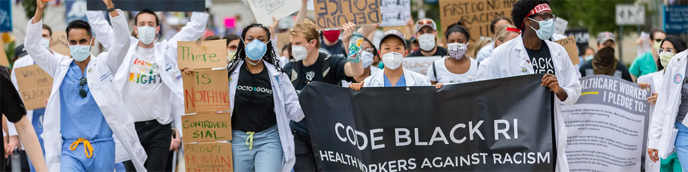 people in hospital attire at a parade or protest
