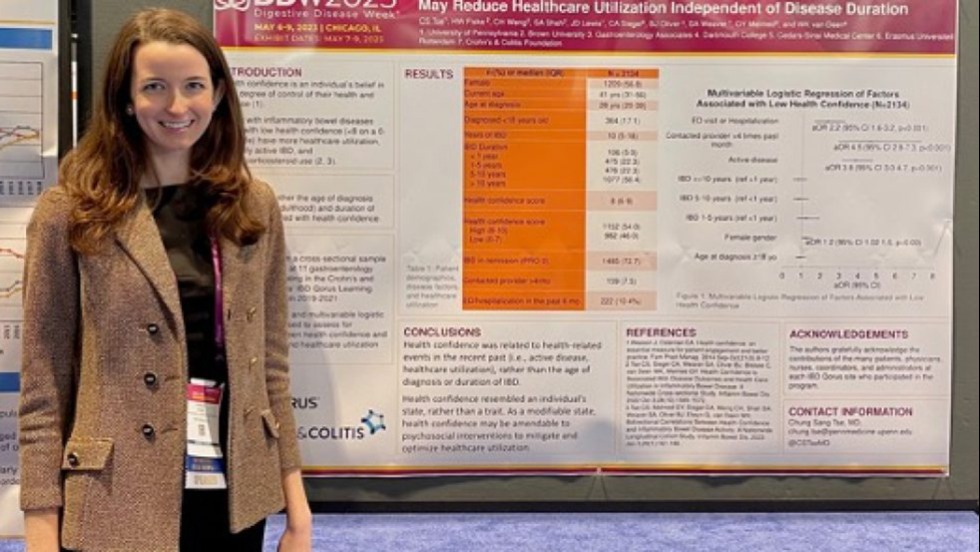 person standing next to a poster