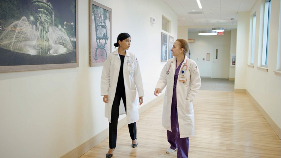 two people in a hallway