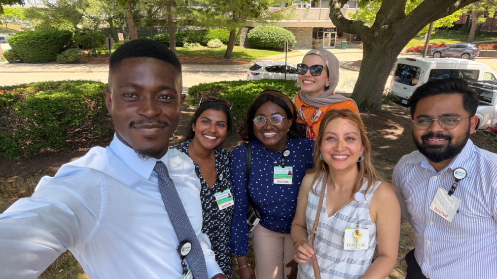 Fellows posing for pic outside